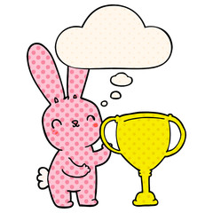 cute cartoon rabbit with sports trophy cup and thought bubble in comic book style