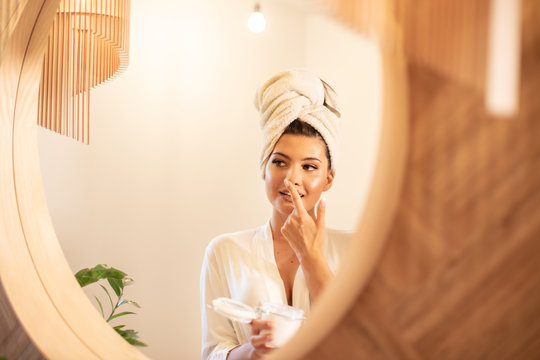 Young beautiful woman in bathroom.