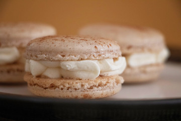 Cinnamon Bun Macaron Cookies A festive flavor. Perfect for fall or winter, Thanksgiving and Christmas. A delicate sweet treat. Baking or cooking, recipe photo.