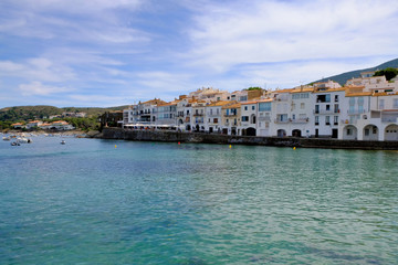 Fototapeta na wymiar Sea landscape with Cadaques, Catalonia, Spain near of Barcelona. Scenic old town with nice beach and clear blue water in bay. Famous tourist destination in Costa Brava with Salvador Dali landmark