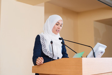 Young confident muslim businesswoman in suit and hijab