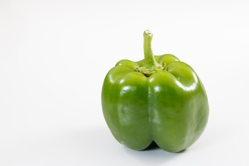 Green Bell Pepper on a white background. - 274997639
