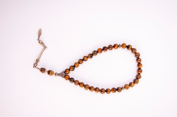 Fototapeta premium Rosary on white background rosary