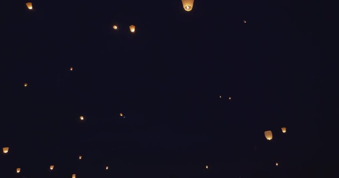 Light lanterns flying on night sky
