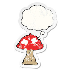 cartoon mushroom and thought bubble as a distressed worn sticker