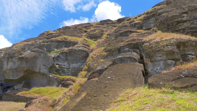 DRONE: Flying above unfinished El Gigante moai statue on sunny Easter Island. Spectacular view from above of a sculpture with human features made of volcanic matter left unerected on exotic island.