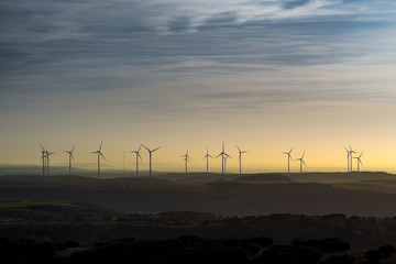 Fototapeta na wymiar landscape windmill horizon sunset clouds