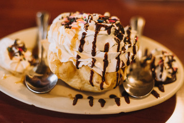 Man eating fried ice cream and paying bill at mexican restaurant