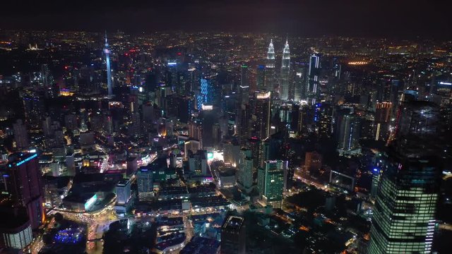 night time illuminated kuala lumpur downtown cityscape aerial panorama 4k malaysia