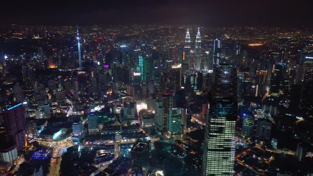 night time illuminated kuala lumpur downtown cityscape aerial panorama 4k malaysia