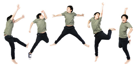 Portrait of happy little Asian child jumping isolated on white