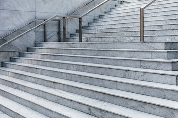 Modern marble staircase leading to the business center