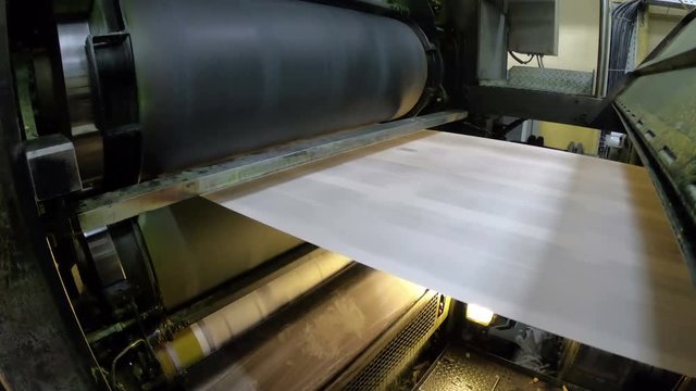 Breaking news out of a newspaper offset printing paper roll