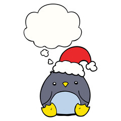 cute cartoon penguin wearing christmas hat and thought bubble