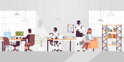 people vs robots working in creative co-working open space coworkers businesspersons sitting at workplace artificial intelligence concept modern office interior full length horizontal