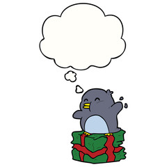 cartoon penguin on present and thought bubble