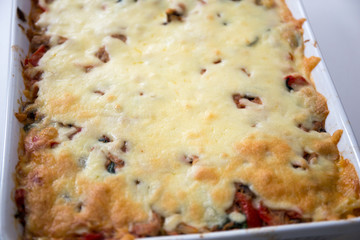 tuna pasta bake with cheese and tomatoes.