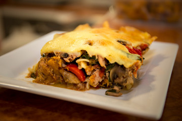 tuna pasta bake with cheese and tomatoes.