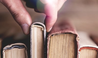 Image of a hand selecting a old