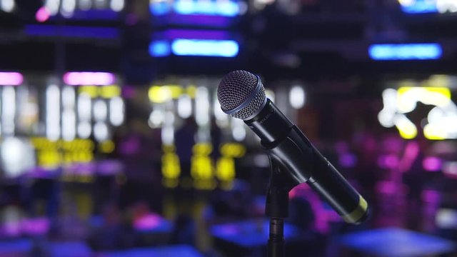 close-up of the microphone on the stage stand in the night bar. beginning stand up in the evening. An evening of stand up Comedy. the atmosphere in the club before the performance