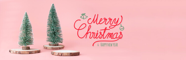 Merry Christmas and happy new year word at christmas tree on wood log slice with present box on...