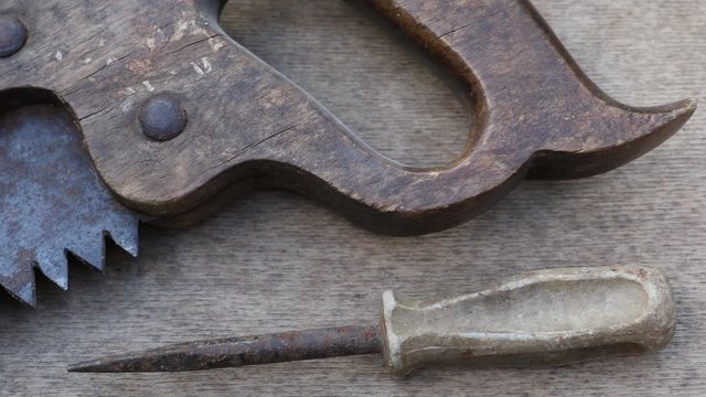 Different construction and hand tools on wooden board, maintenance and reparing concept