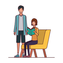 couple sitting on chair with book in hands