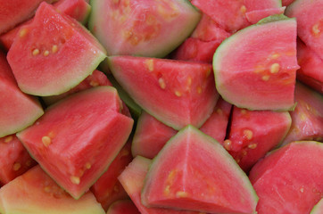 Pink guava slices as background
