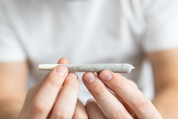 Cannabis use concept. Marijuana joint Close up.