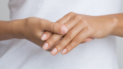Nude Nails. Woman Showing her Manicure, Closeup