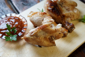 pieces of fried chicken with tomato sauce