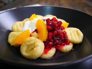 Beautiful food on plate. Lazy dumplings and Fruits. Cottage Cheese Gnocchi