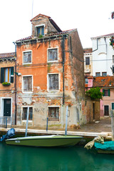 Fototapeta na wymiar Wonderful corner of Venice with a canal and old houses