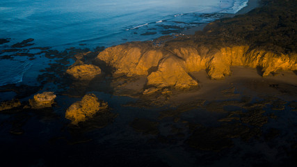Fototapeta na wymiar Aerial View of Rugged Coastline Along the Great Ocean Road, Australia