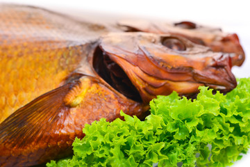 Smoked fish on plate close up