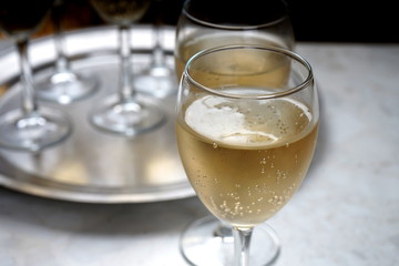 glasses with sparkling wine on a metal dressing