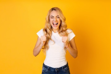 Excited Lady Screaming And Making Winner Gesture