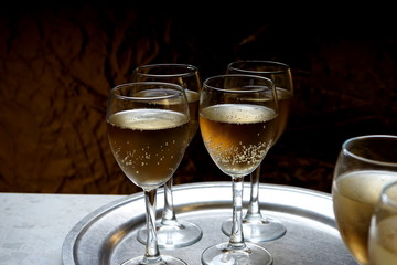 glasses with sparkling wine on a metal dressing