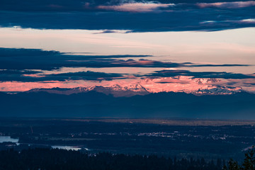 Sunset alpenglow over Mount Baker, Washington, USA seen from Canada