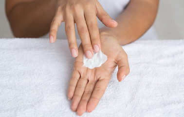 Moisturize Skin. Woman Spreading Nourishing Cream on Palm