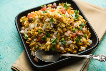 Bhelpuri Chaat/chay is a road side tasty food from India, served in a bowl or plate. selective focus