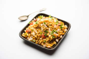 Bhelpuri Chaat/chat is a road side tasty food from India, served in a bowl or plate. selective focus