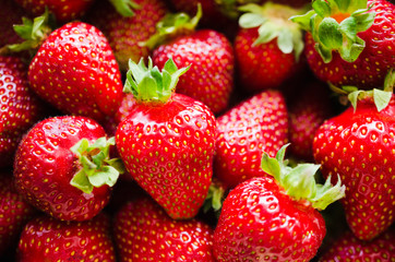 Background of fresh ripe strawberries macro. Organic juicy berries.