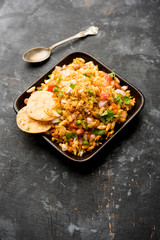 Bhelpuri Chaat/chat is a road side tasty food from India, served in a bowl or plate. selective focus
