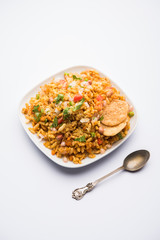 Bhelpuri Chaat/chat is a road side tasty food from India, served in a bowl or plate. selective focus