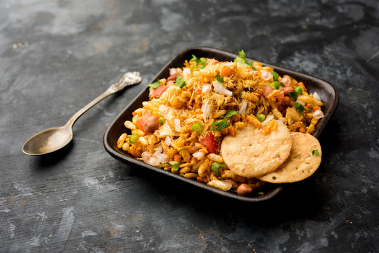 Bhelpuri Chaat/chat is a road side tasty food from India, served in a bowl or plate. selective focus