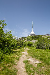 Road to transmitter on mountain top. Summer weather.
