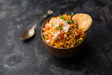 Bhelpuri Chaat/chat is a road side tasty food from India, served in a bowl or plate. selective focus