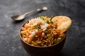 Bhelpuri Chaat/chat is a road side tasty food from India, served in a bowl or plate. selective focus