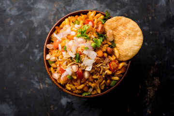 Bhelpuri Chaat/chat is a road side tasty food from India, served in a bowl or plate. selective focus